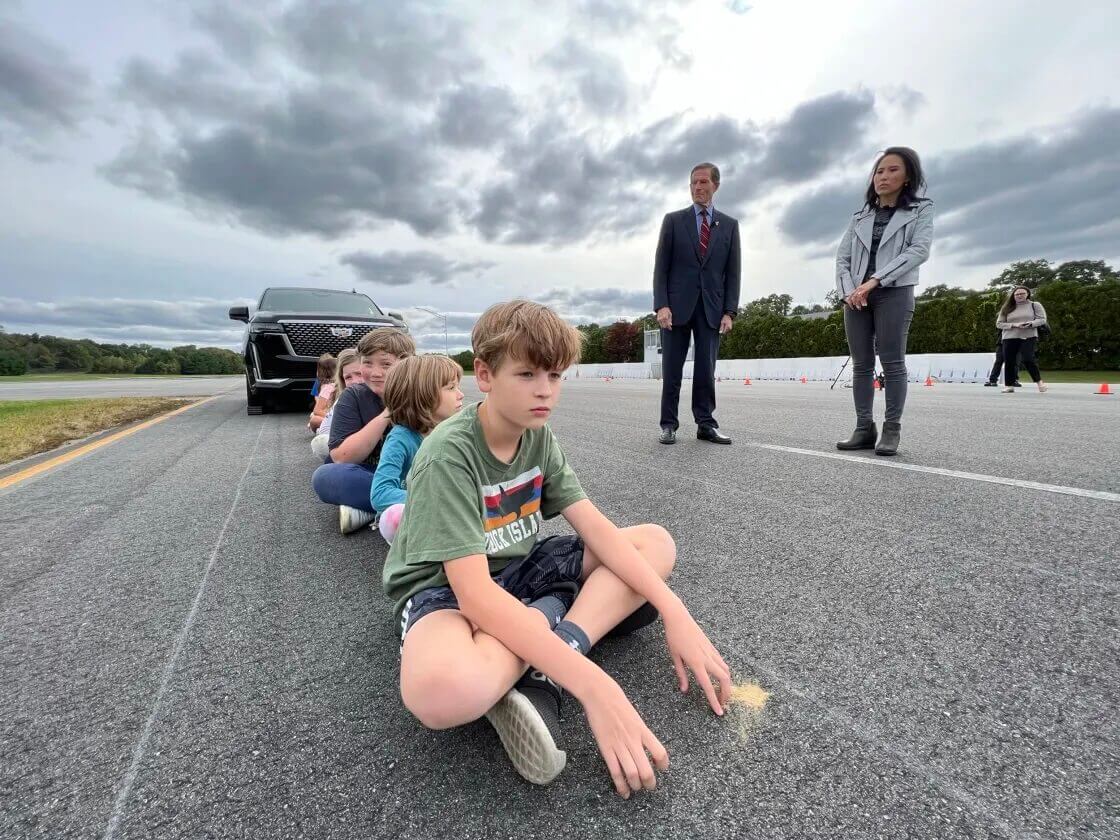 Elementary school children at an SUV and pickup truck visibility demonstration conducted by NBC News.