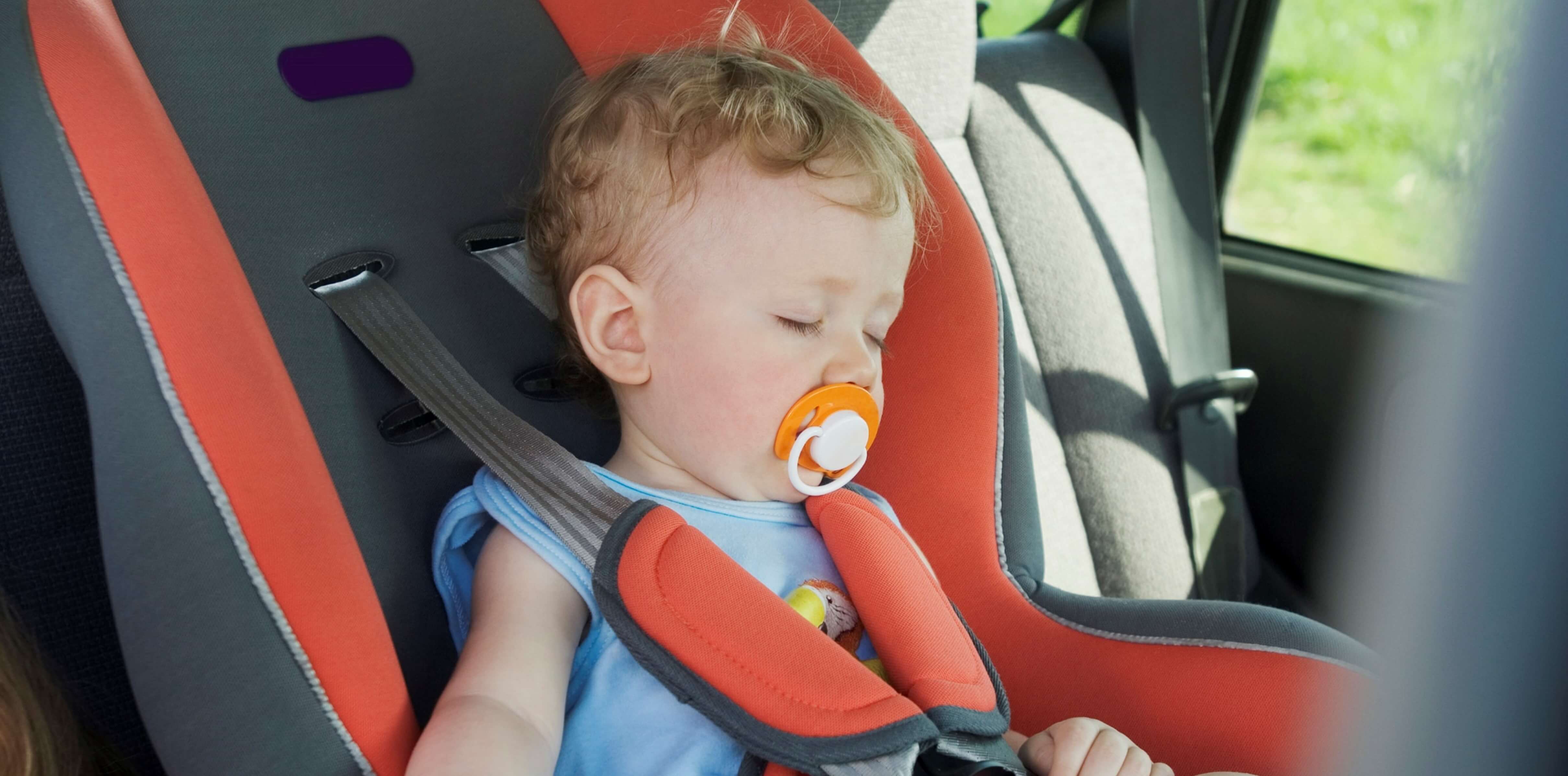 Child asleep in car seat